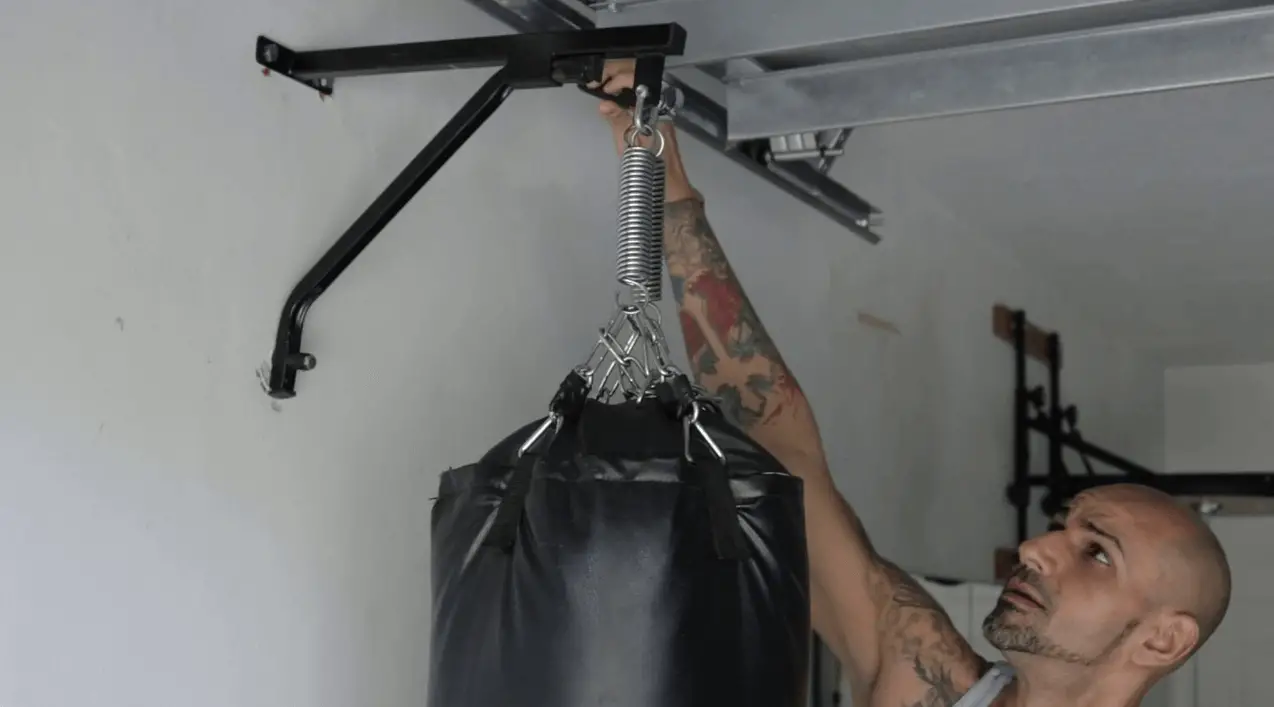 comparing Hanging Your Bag from the Ceiling to using a heavy bag stand